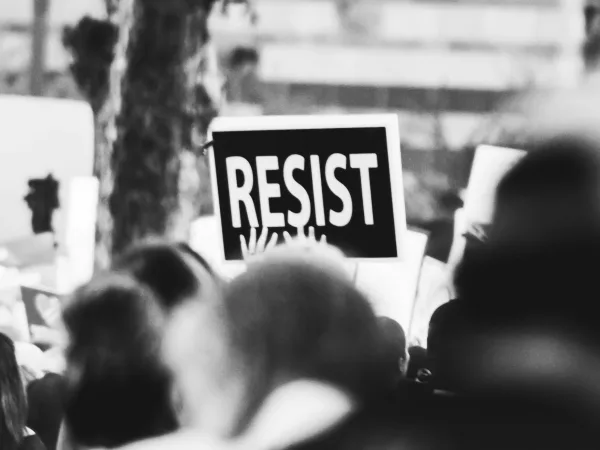 monochrome photo of resist signage